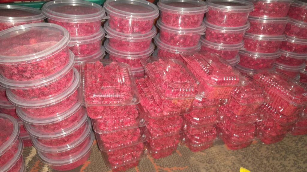 Stacked containers of mabuyu baobab candy in clear plastic jars.