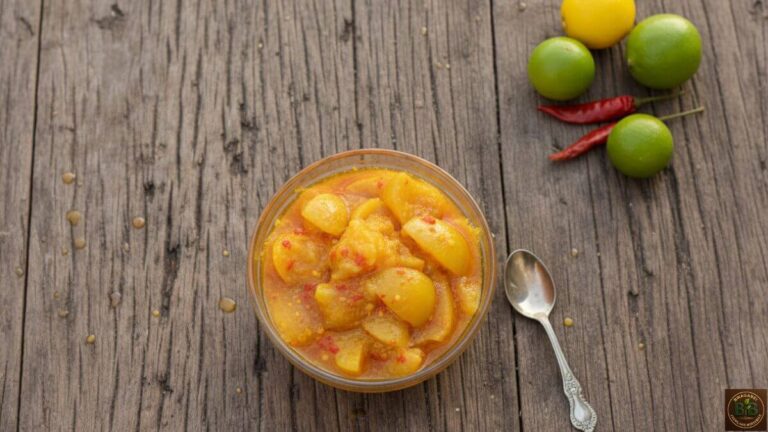 Close-up of homemade Mombasa lime pickle (Achari ya Ndimu) with visible spices.
